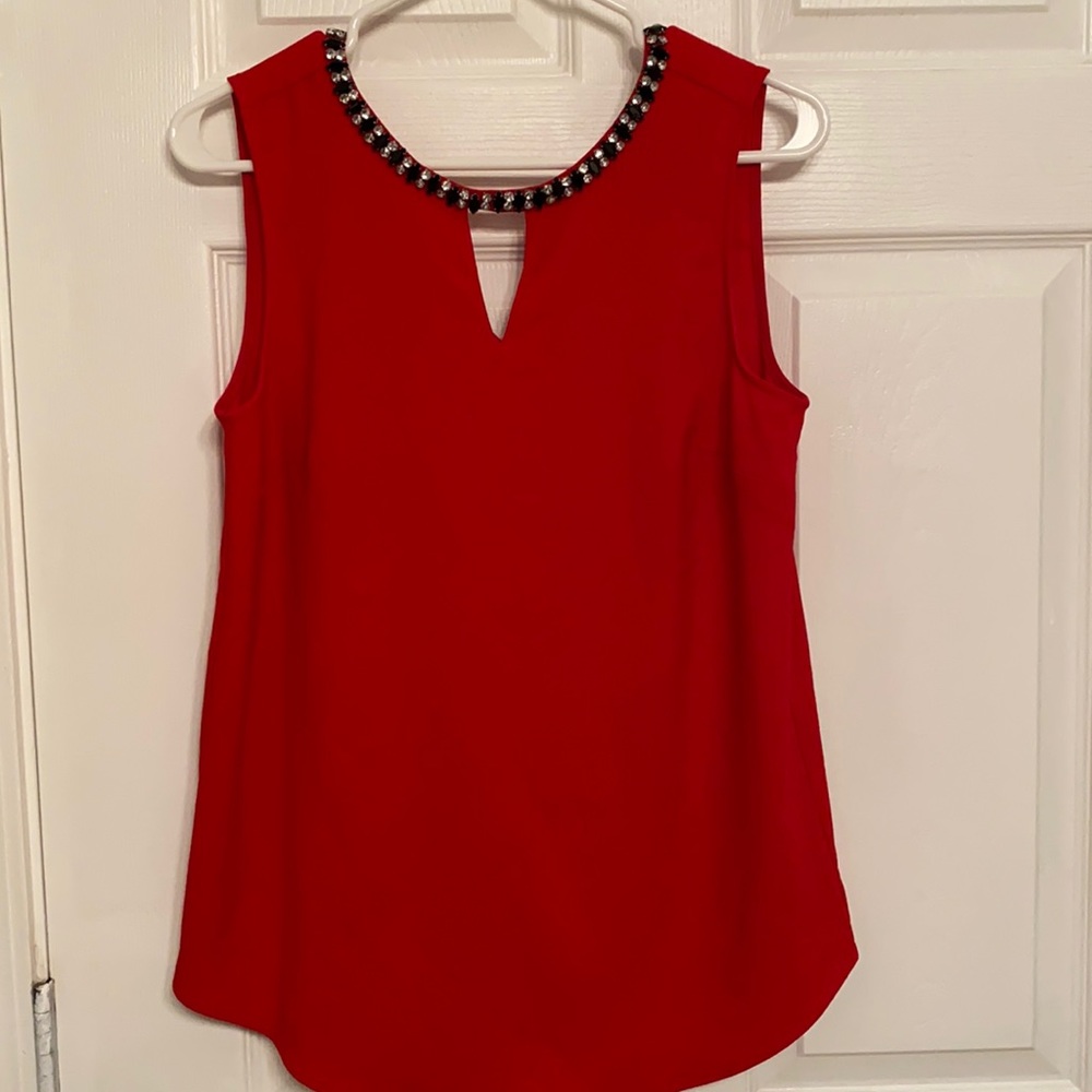 Red blouse perfect for work! Runs a little big.